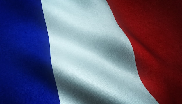 Strzał zbliżenie macha banderą Francji z ciekawymi teksturami