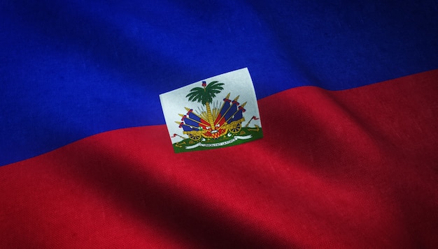 Strzał zbliżenie macha flagą Haiti z ciekawymi teksturami