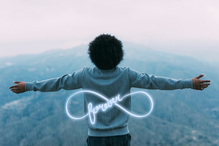 Bezpłatny plik Zdjęcie symbol pętli nad inspirującym widokiem