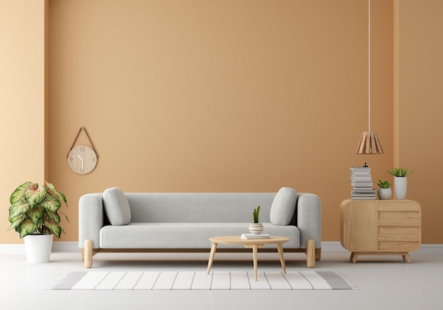 Bezpłatne zdjęcie szara sofa w brązowym salonie z miejscem na kopię