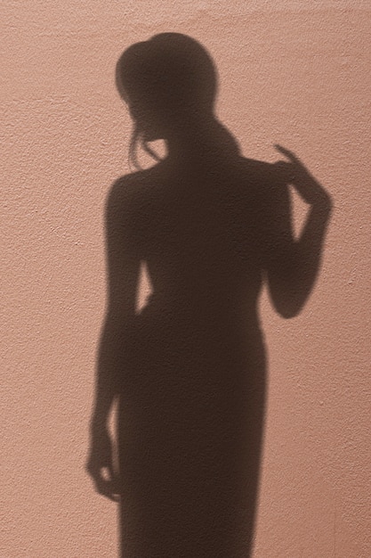 Bezpłatne zdjęcie tło z cieniem kobiety