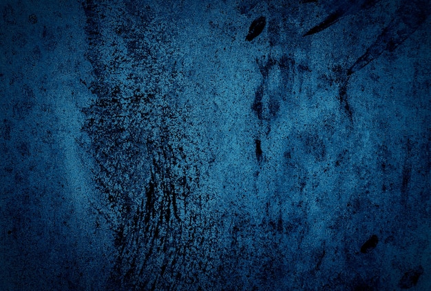 Vintage grunge niebieski tekstury betonu studio ściany tło z winietą.
