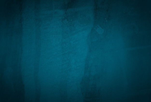 Bezpłatne zdjęcie vintage grunge niebieski tekstury betonu studio ściany tło z winietą.