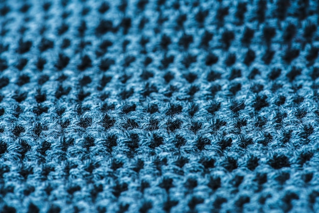Zbliżenie błękitnej wełny tekstylna tekstura makro-