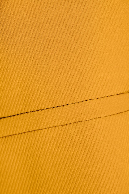 Zbliżenie na teksturowanej żółty płaszcz
