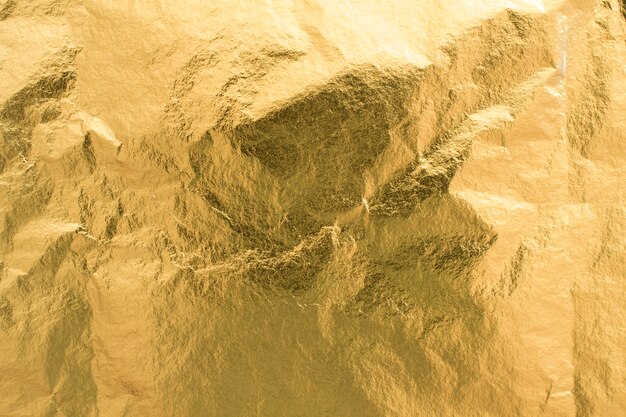 Złoty folia tekstura tło, błyszczący papier pakowy element dekoracji