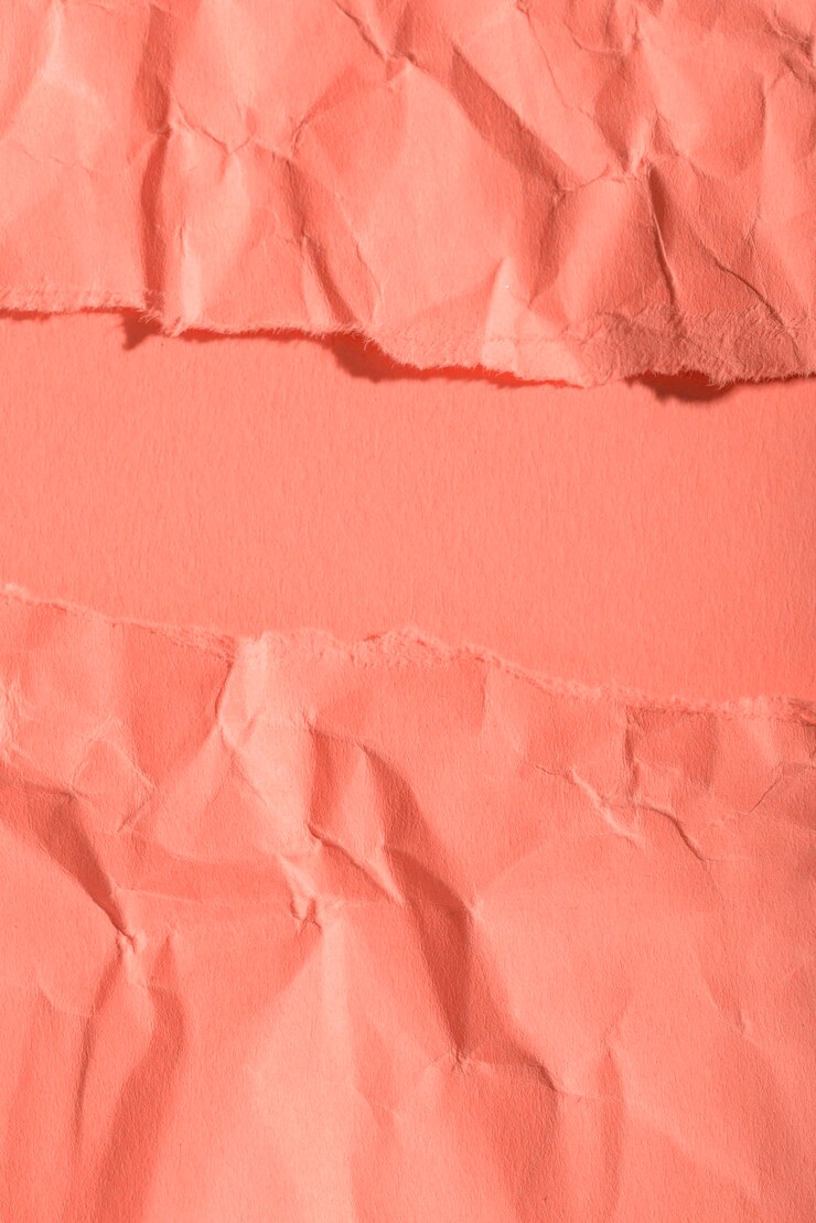 Bezpłatny plik Zdjęcie zmięty papier tekstury na koralowym tle