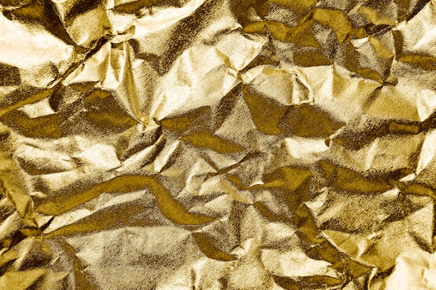 Bezpłatne zdjęcie zmięty papier złoty teksturowanej tło