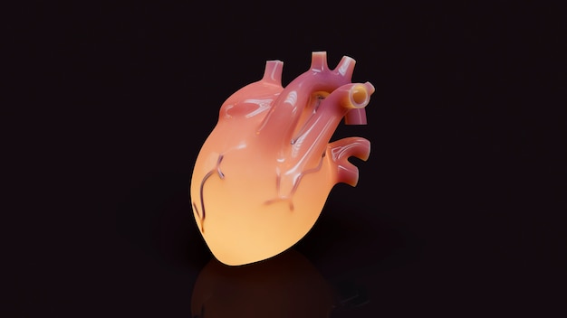 Bezpłatne zdjęcie Żółte anatomiczne serce z brązowym tłem