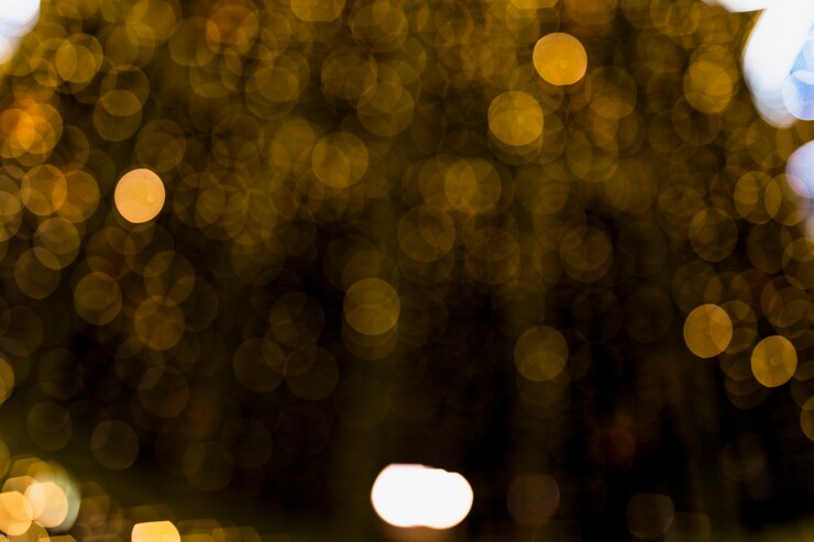 Photo Gratis abstract gold background with soft blur bokeh light effect
