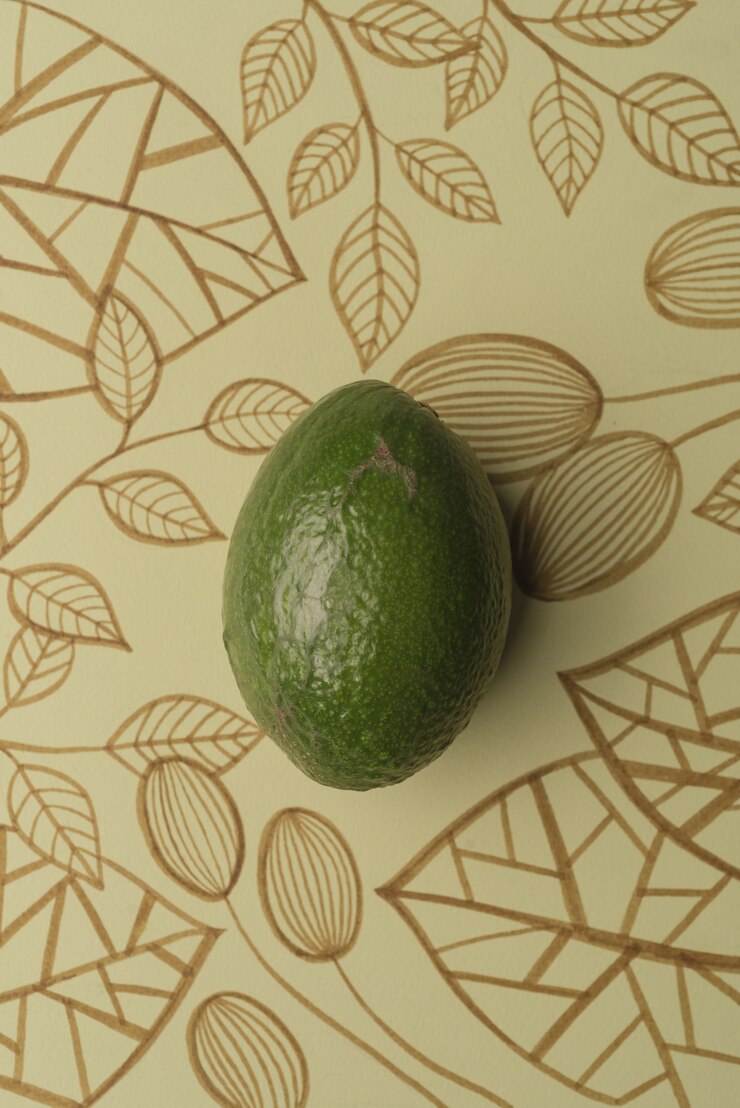 Foto gratuito aguacate sobre fondo floral de contorno