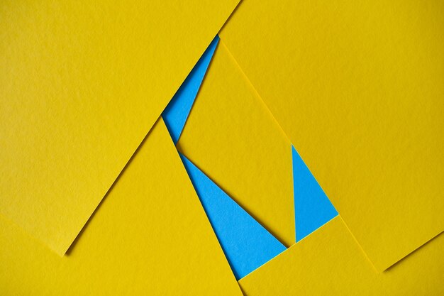 Amarillo y azul composición geométrica fondo de cartón amarillo y azul