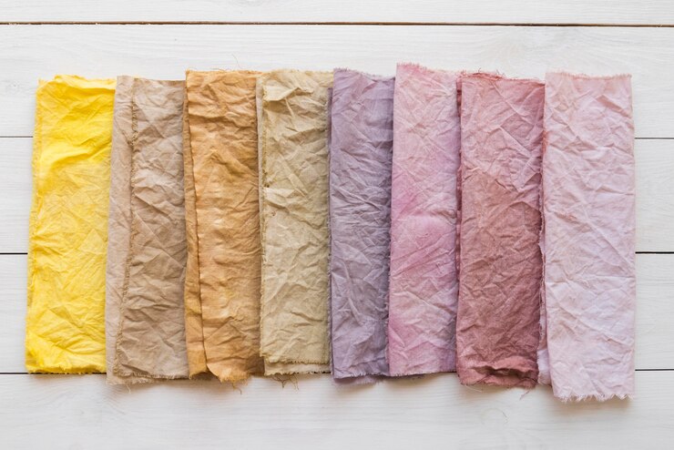 Foto gratuito arreglo de telas de colores de vista superior con pigmentos naturales