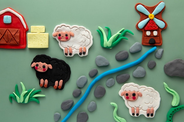 Arte de plastilina con arreglo de animales de granja.