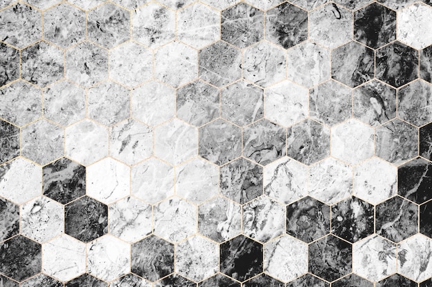 Azulejos de mármol gris hexagonal con dibujos