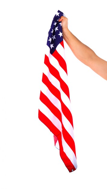 Bandera americana sujetada con una mano