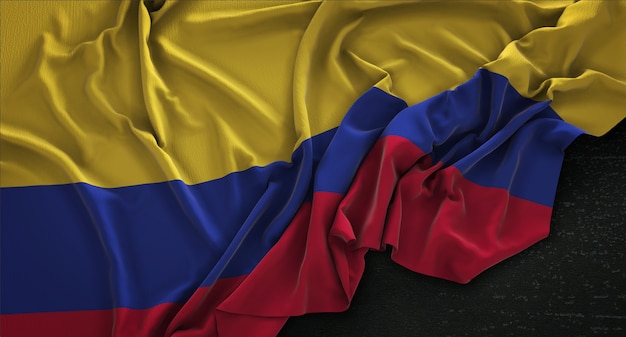 Foto gratuita bandera de colombia arrugado sobre fondo oscuro 3d render