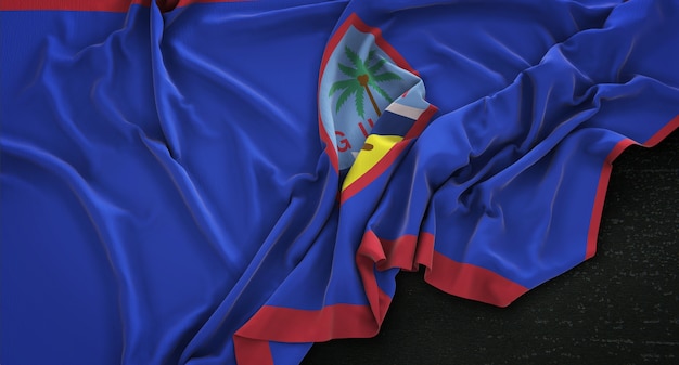 Bandera de Guam arrugado sobre fondo oscuro 3D Render