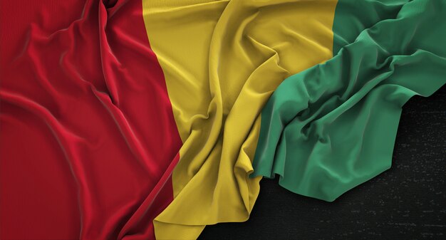 Bandera de Guinea arrugado sobre fondo oscuro 3D Render