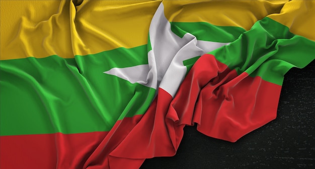 Bandera de Myanmar arrugado sobre fondo oscuro 3D Render