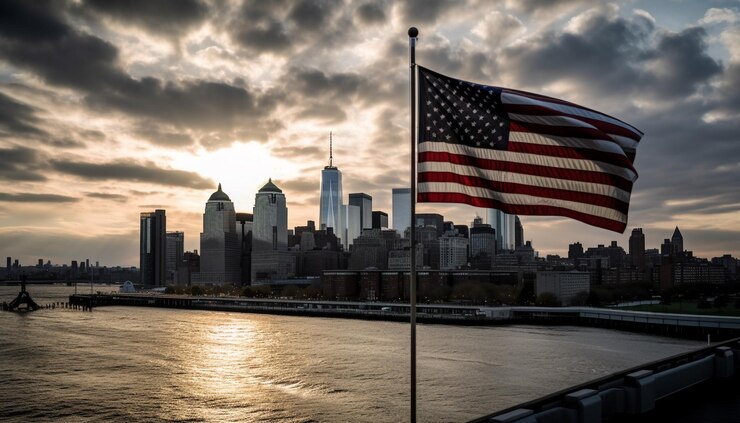 Foto gratuito una bandera ondea frente al horizonte de una ciudad