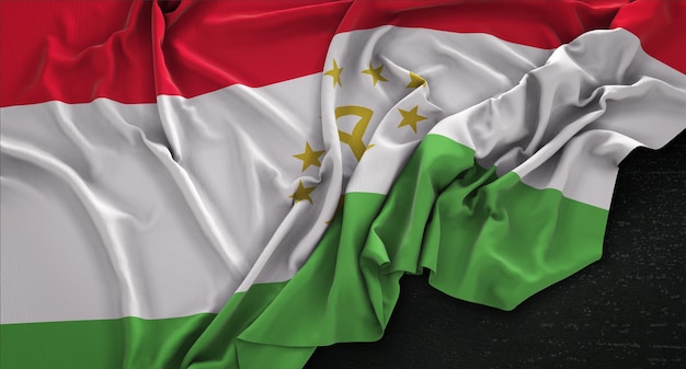 Bandera de Tayikistán arrugado sobre fondo oscuro 3D Render