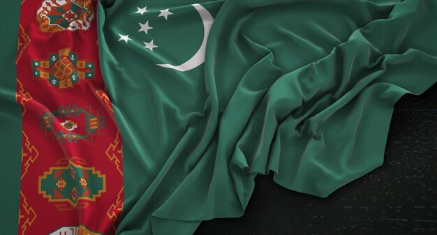 Bandera de Turkmenistán arrugado sobre fondo oscuro 3D Render