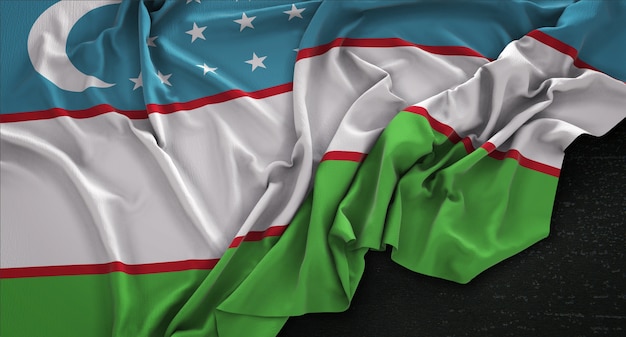 Bandera de Uzbekistán arrugado sobre fondo oscuro 3D Render