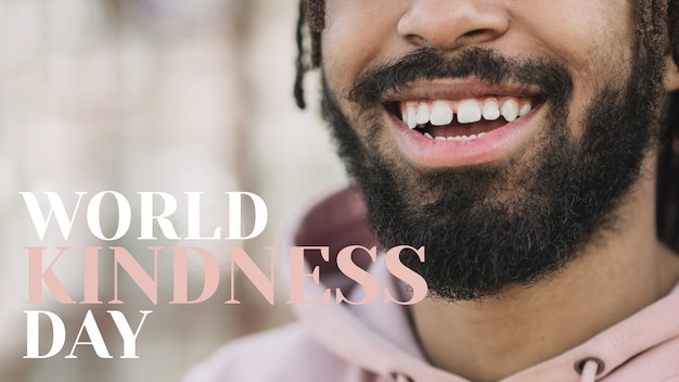 Foto gratuita banner del día mundial de la bondad con hombre sonriendo