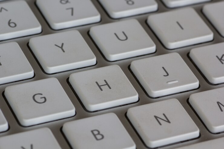 Photo Gratis bidikan close-up sudut tinggi dari keyboard putih
