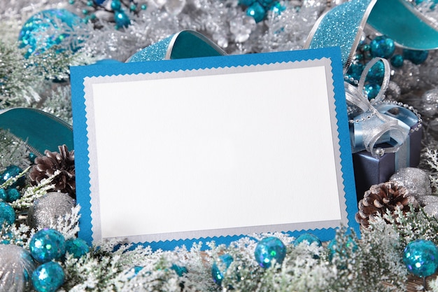 Blue frame with christmas ornaments