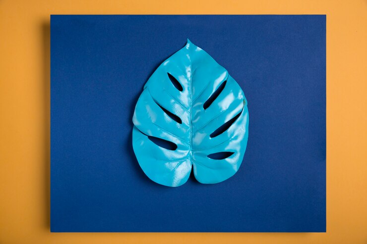 Photo Gratis blue leaf on dark blue rectangle