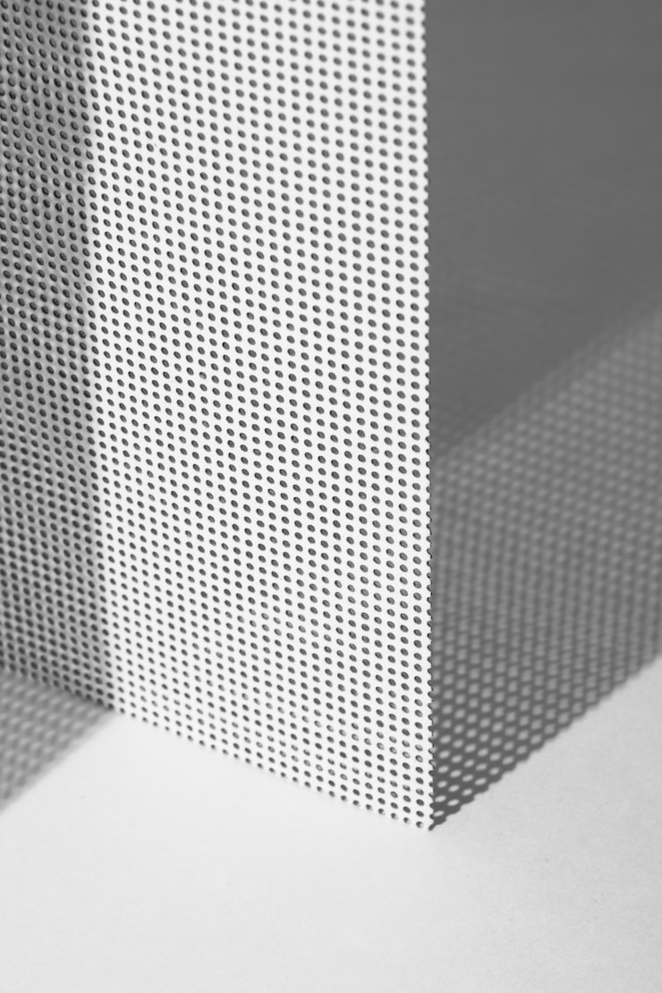 Foto gratuito bodegón de fondo de chapa microperforada
