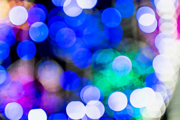 Foto gratuita bokeh de navidad sobre fondo oscuro