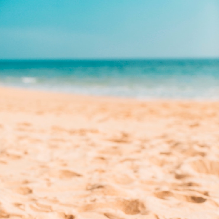 Foto gratuito bokeh de playa de verano para el fondo