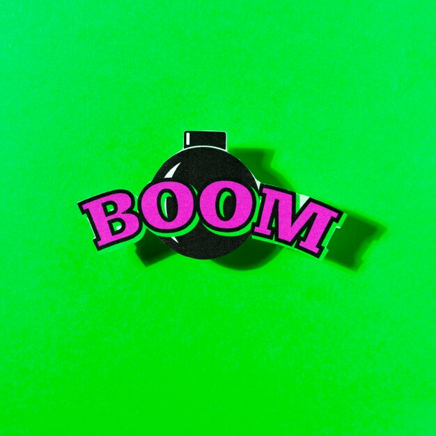 Boom texto en bomba sobre el fondo verde