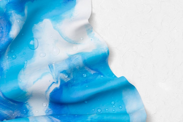 Foto gratuita borde de teñido anudado azul sobre arcilla de plastilina con textura de fondo estético arte creativo de bricolaje