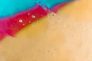 Foto gratuita burbuja abstracta con textura en color beige; fondo rojo y azul