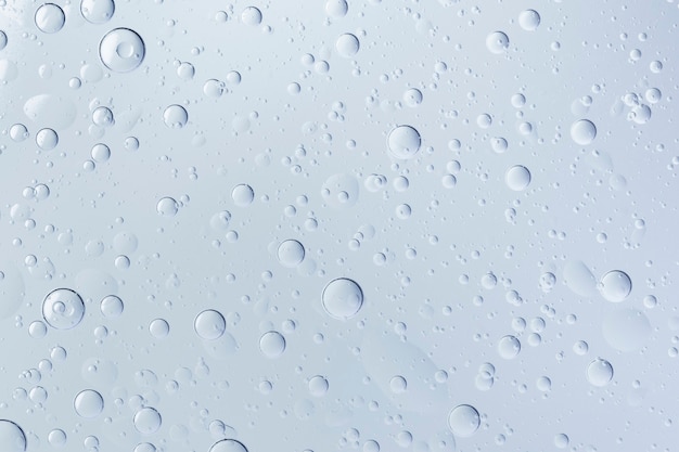 Burbuja de aceite de fondo abstracto azul en papel tapiz de agua