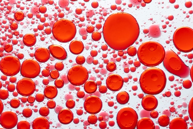 Foto gratuita burbuja de aceite de fondo abstracto rojo en papel tapiz de agua