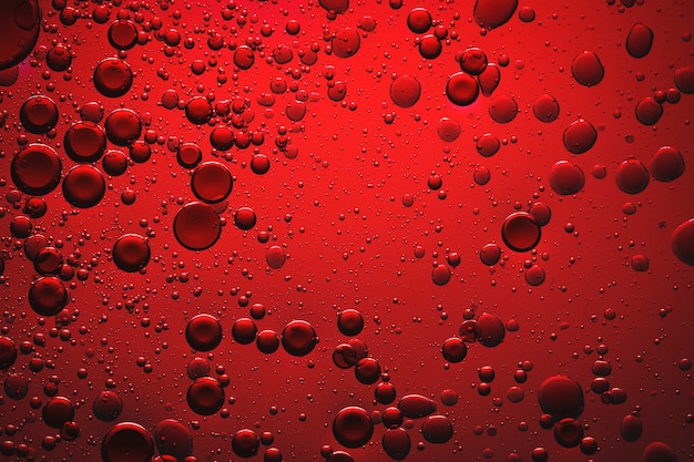 Foto gratuita burbuja de aceite de fondo rojo en el agua