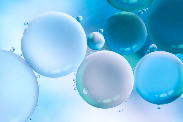 Foto gratuita burbujas azules brillantes y gotas brillantes