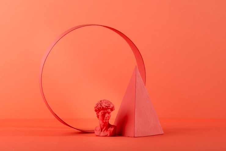 Foto gratuito busto de yeso sobre fondo de coral con formas geométricas