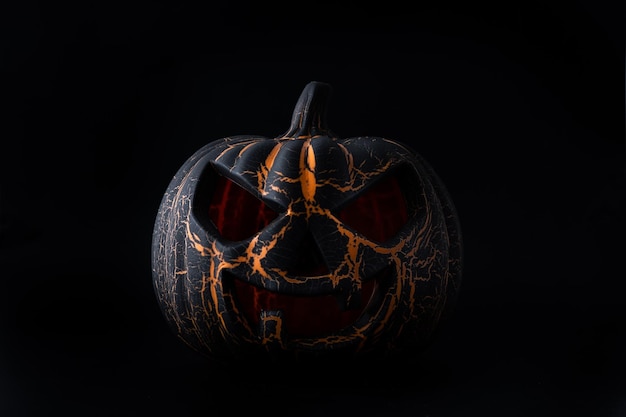 Foto gratuita calabaza de halloween negra sobre fondo negro