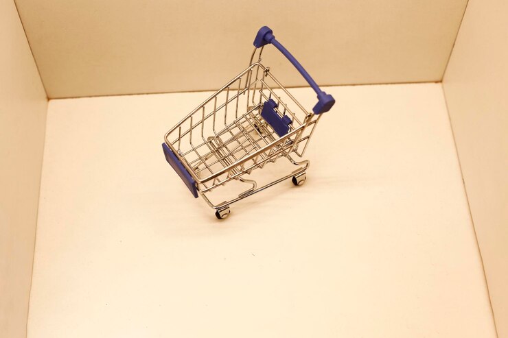 Foto gratuito carrito de compras aislado sobre fondo blanco