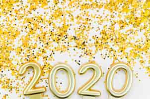 Foto gratuita celebración de año nuevo 2020 y brillo dorado