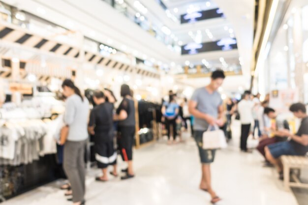 Centro comercial abstracto de la falta de definición y interior de la tienda de ventas al por menor para el fondo