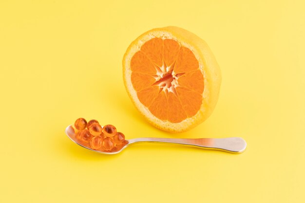 De cerca los complementos alimenticios con naranja