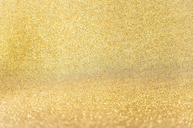 Foto gratuita cerca de fondo dorado brillo