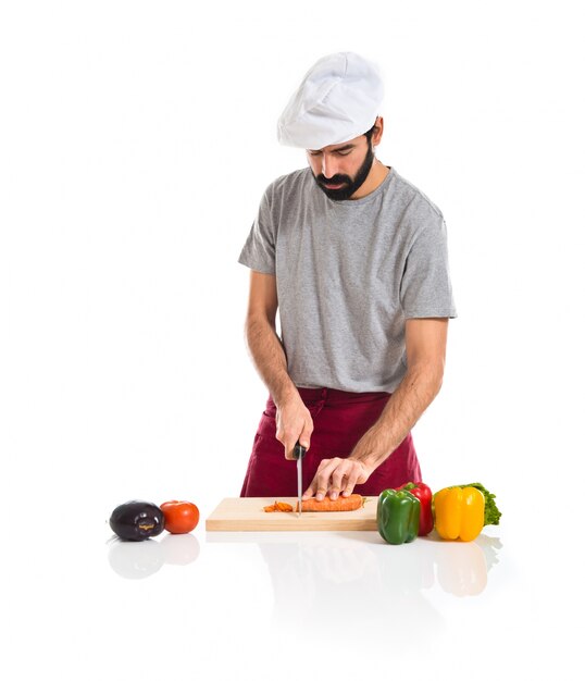 Chef cortando una zanahoria